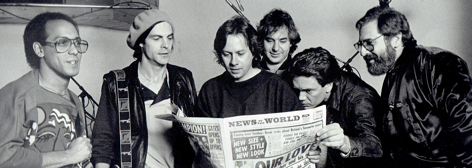 From the "Dangerous Moments" lp recording sessions left to right: 
Carmine Rojas, Bass Guitar, Martin Briley, the late Peter Wood, keyboards, Anton Fig Drums, G.E. Smith, Guitar, and producer Phil Ramone.